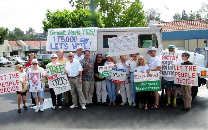 Displaying petitions: volunteers in front of armored truck.